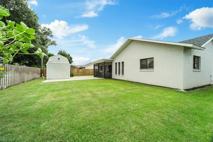 View of yard with a storage shed