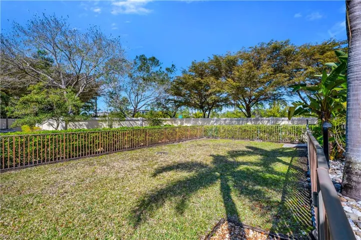 View of fenced backyard