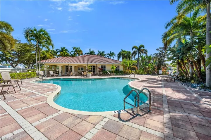 Community pool featuring a patio area