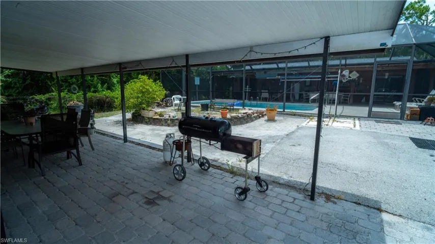 View of patio with a lanai