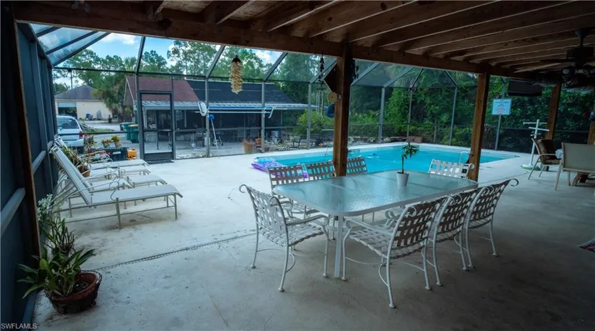 View of terrace featuring glass enclosure