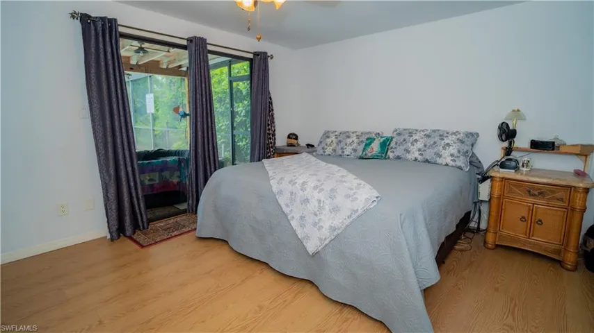 Bedroom featuring ceiling fan and light wood-type flooring
