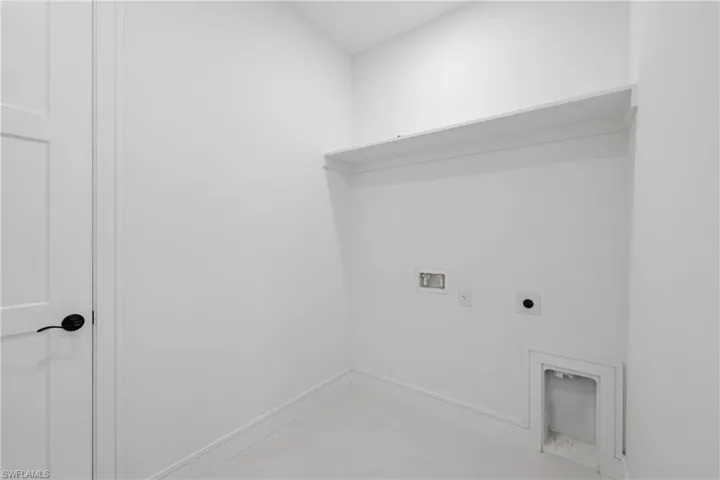 Clothes washing area with electric dryer hookup and washer hookup