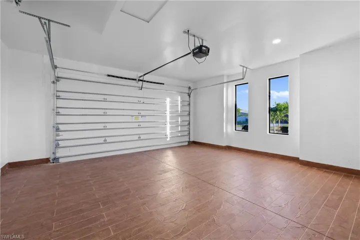 Garage featuring a garage door opener
