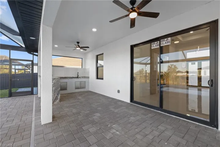 View of patio with area for grilling and sink