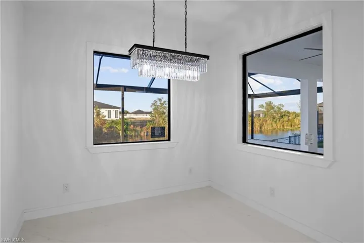 Empty room featuring a water view and a wealth of natural light