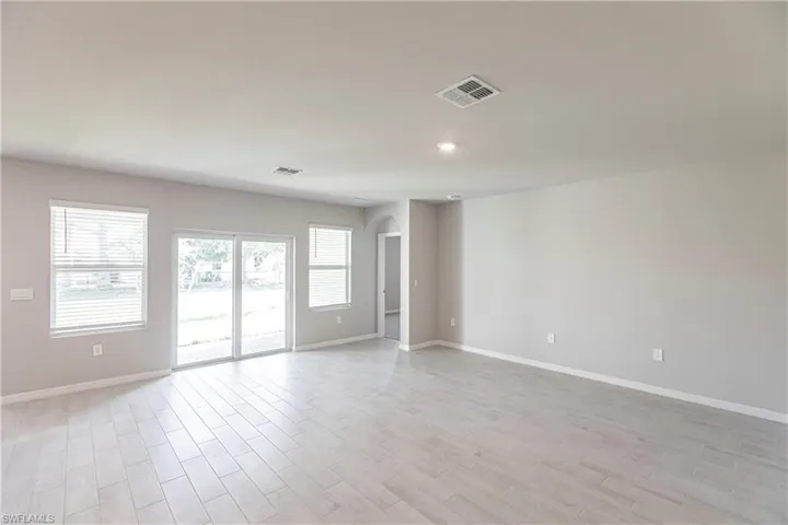 Spare room with light hardwood / wood-style floors
