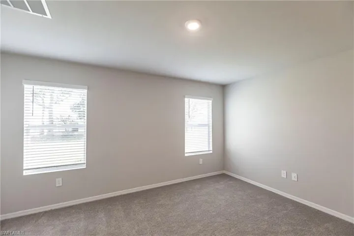 Spare room with carpet and plenty of natural light