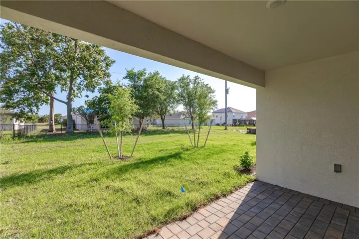 View of yard with a storage unit