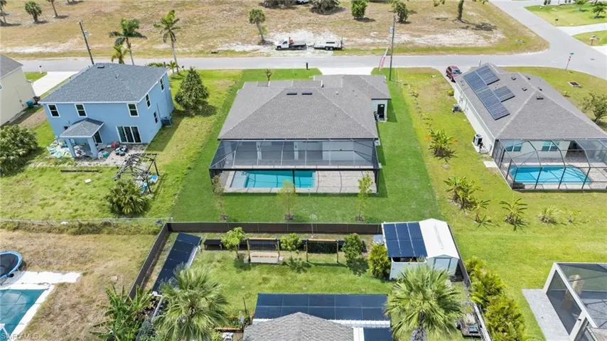 Birds eye view of property with a residential view