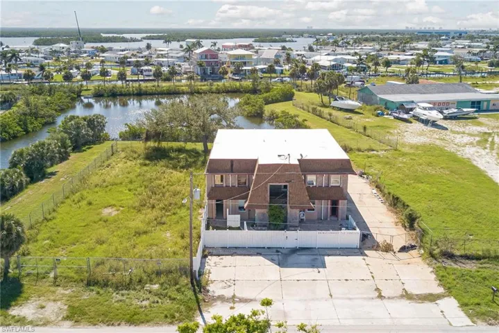 Aerial perspective of suburban area with a nearby body of water