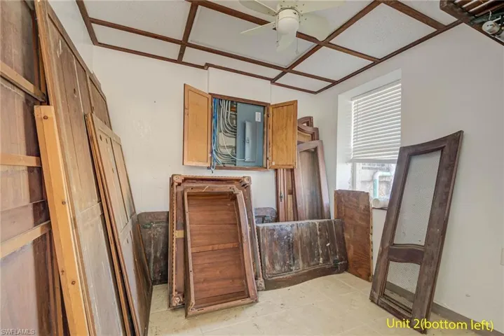 Bedroom with ceiling fan and light tile patterned floors