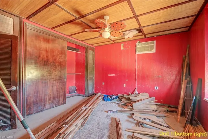 Empty room with wooden ceiling and a ceiling fan