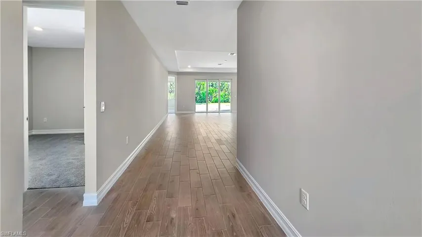 Hall featuring light carpet