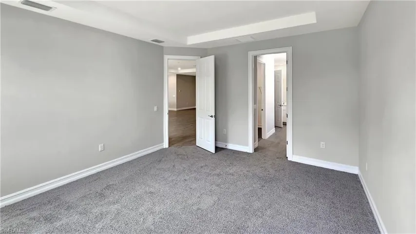 Unfurnished bedroom with carpet floors