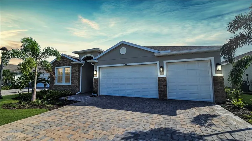 Ranch-style house featuring a 3 car garage
