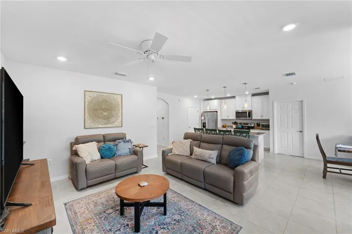 Tiled living room with ceiling fan