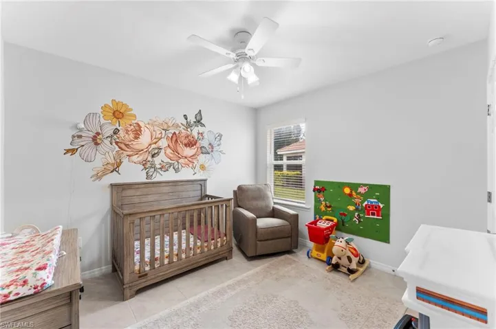 Tiled bedroom with ceiling fan