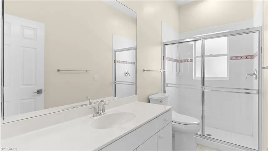 Full guest bathroom #3 with vanity and a shower stall