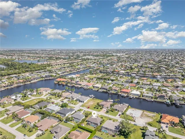 View of property location featuring nearby suburban area and a large body of water