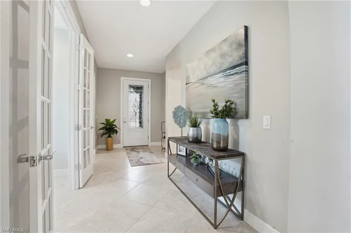 Doorway with recessed lighting, tile patterned floors, and french doors