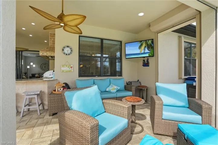 View of patio / terrace with an outdoor hangout area, grilling area, and ceiling fan