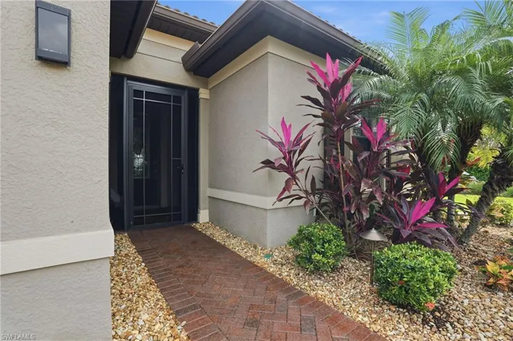 Property entrance featuring stucco siding