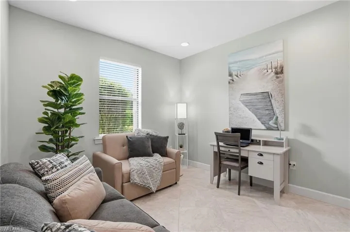 Home office with recessed lighting and baseboards