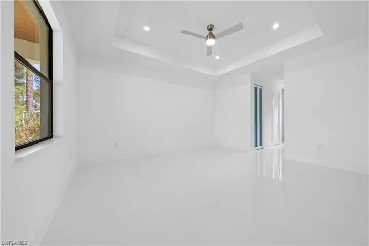 Spare room with a ceiling fan and recessed lighting