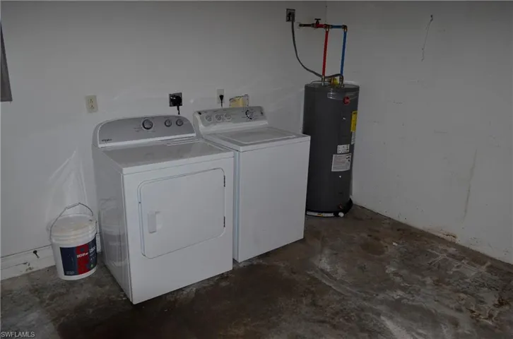 Laundry room with water heater and independent washer and dryer