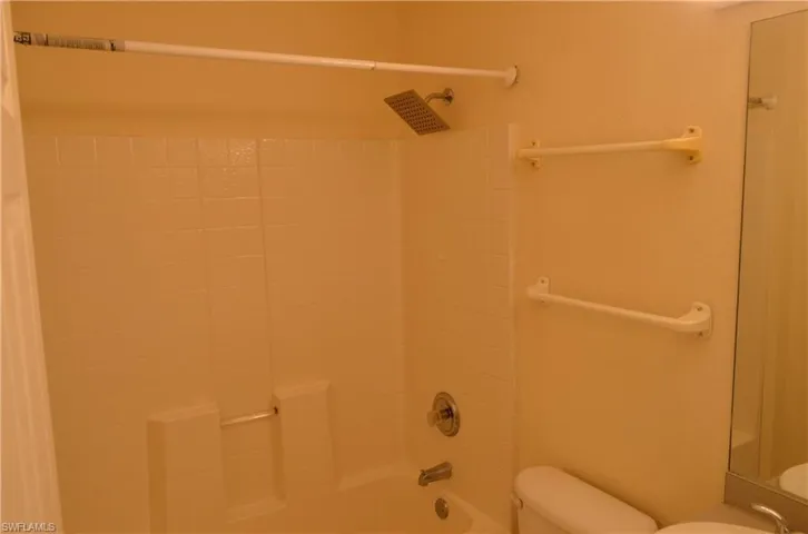 Full bath with shower / bath combination and toilet