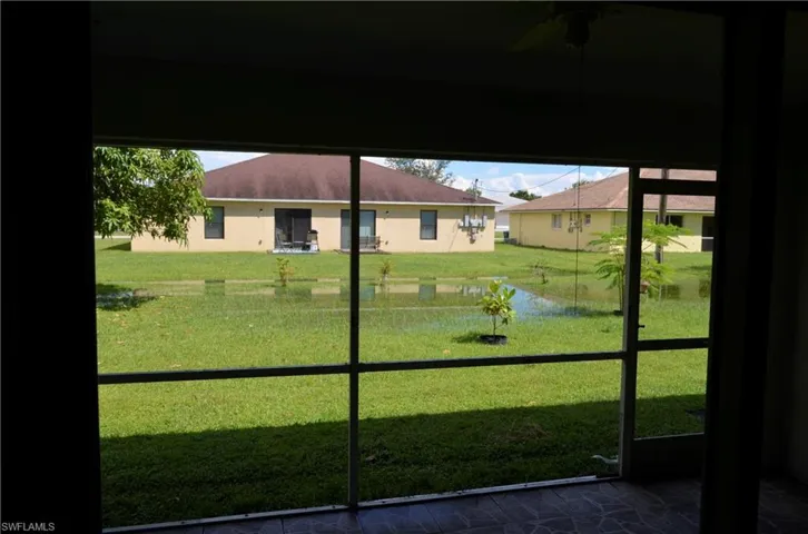 Lanai to outside featuring ceiling fan