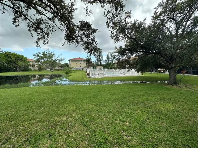 View of green lawn with a water view