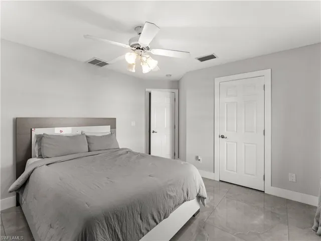 Bedroom featuring baseboards and a ceiling fan
