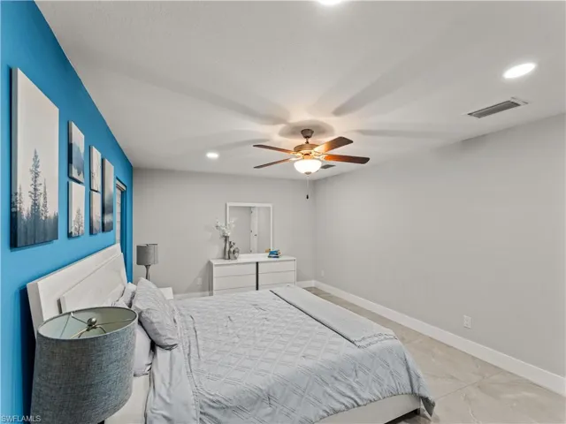 Bedroom featuring recessed lighting, ceiling fan, and tile patterned flooring