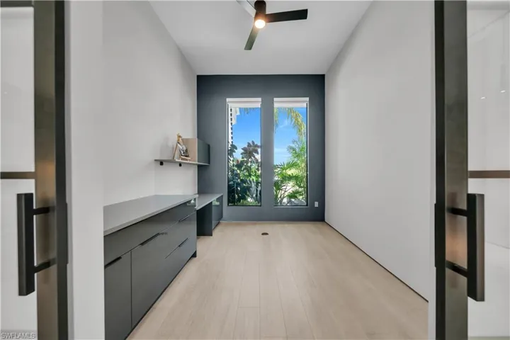 Room featuring light wood-finish flooring and a ceiling fan