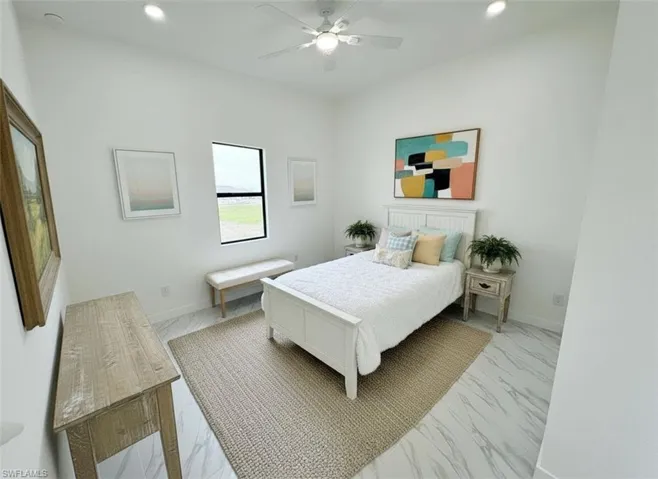Bedroom featuring light marble finish flooring, recessed lighting, and ceiling fan