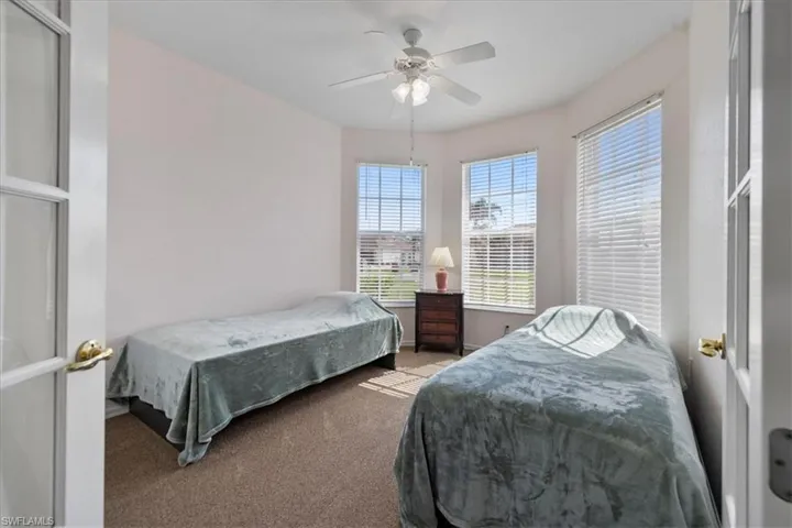 Bedroom featuring carpet and ceiling fan