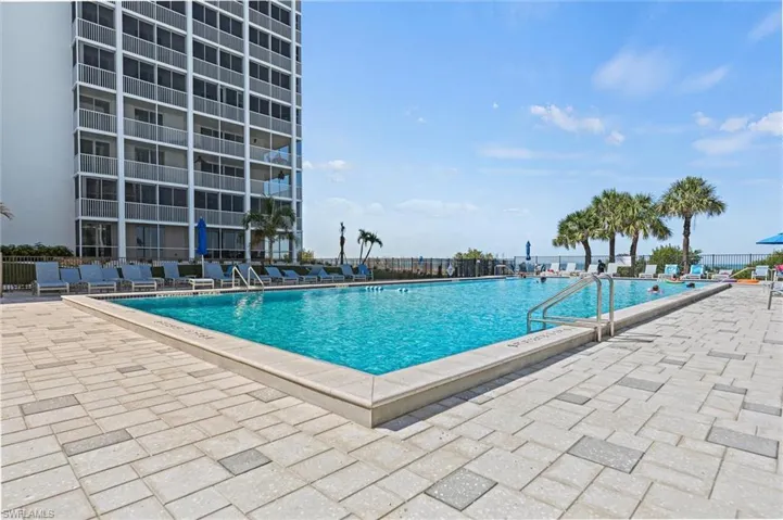 Community pool with a patio area
