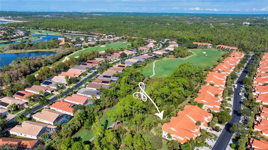 View of property location featuring nearby suburban area and a golf course