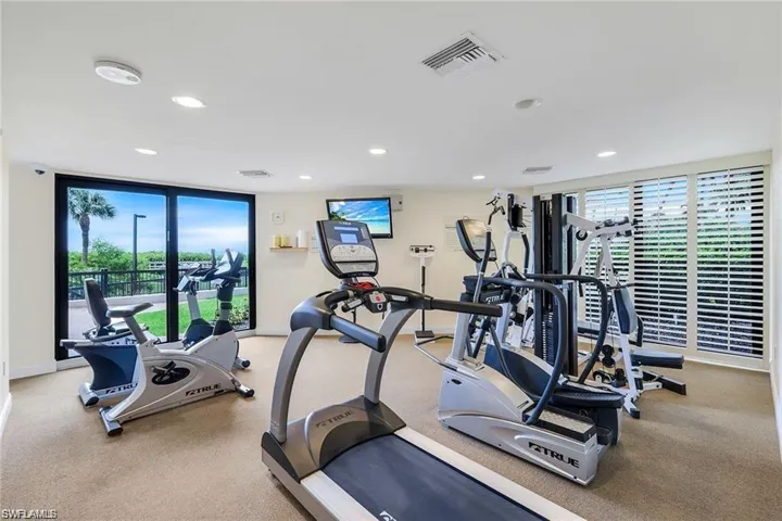 Gym featuring recessed lighting and carpet flooring