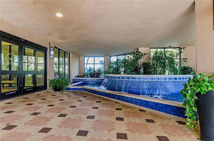 View of two waterfall features at front entry to building.    The rush of water is exciting to hear and watch and will definitely relax you while you hail a taxi or Uber.