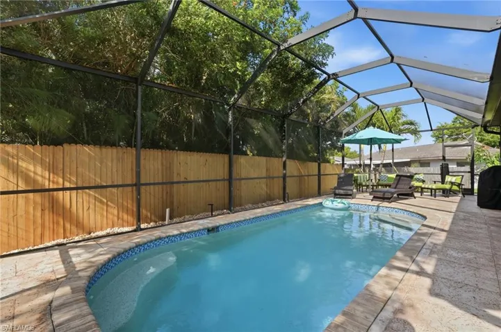 Screened-in lanai and pool enclosure.