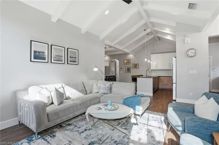 Vaulted ceilings help make this living room feel large and bright.