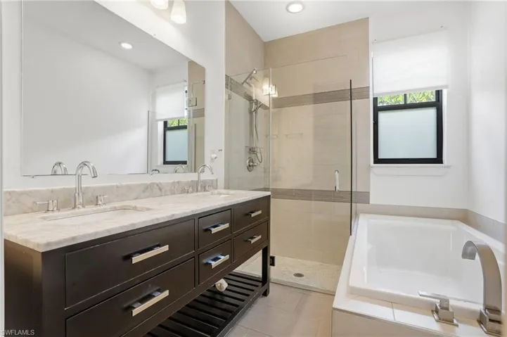 Stand alone shower, soaking tub, and dual sink vanity.