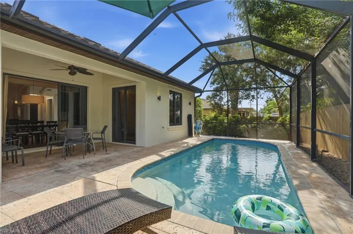 Expansive screened pool enclosure offering year-round enjoyment.