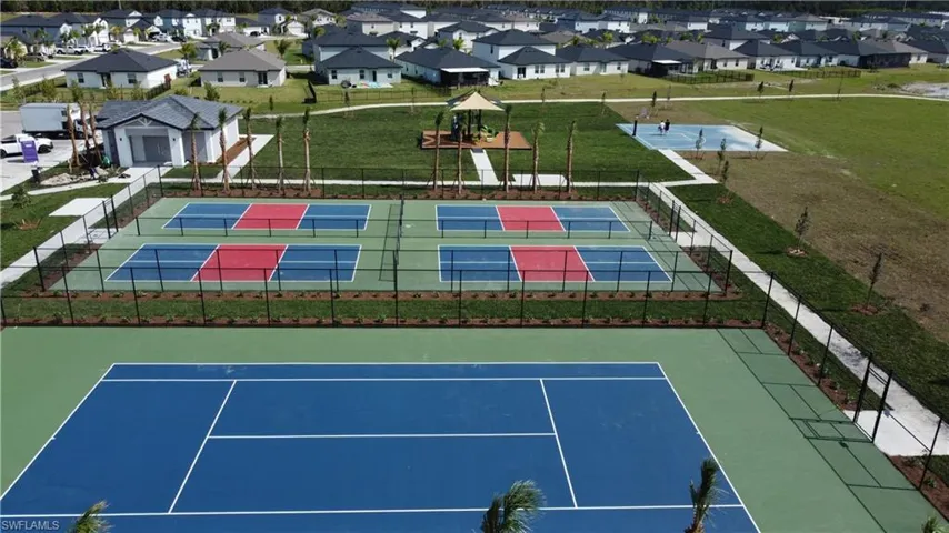 Community amenities featuring multiple recreational courts, including a full-size tennis court and four pickleball courts, playground and basketball court