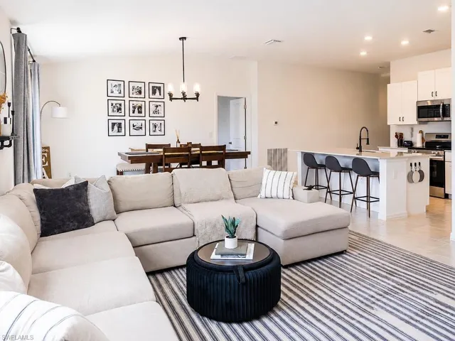 Open-concept living area with light-toned walls