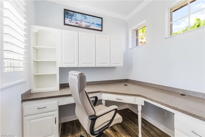 Great office with built in desk and cabinets