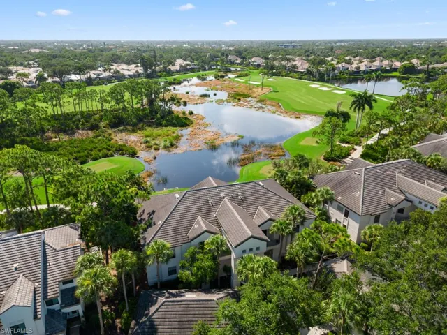 Birds eye view of property with a water and golf view (Marsh course)